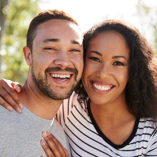 couple poses for photo outside